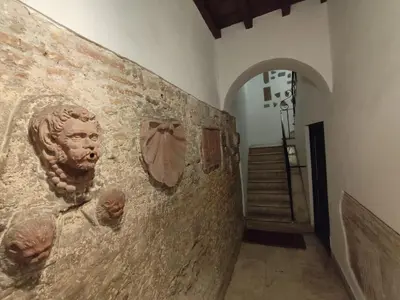 a wall with a statue of a face on it at Bijoux de Rome Navona Luxury Apartment in Rome
