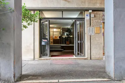 an entrance to a building with an open door at Vatican's Apartment in Rome