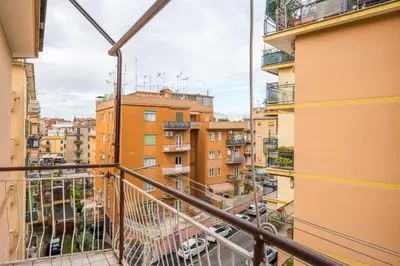 a balcony with a view of buildings at Silver Dream Cornelia, Elegant Apt with Car Park in Rome