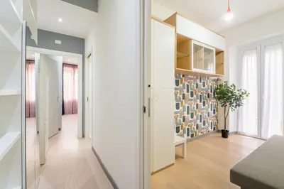 a hallway of a home with a wall of glass at Silver Dream Cornelia, Elegant Apt with Car Park in Rome