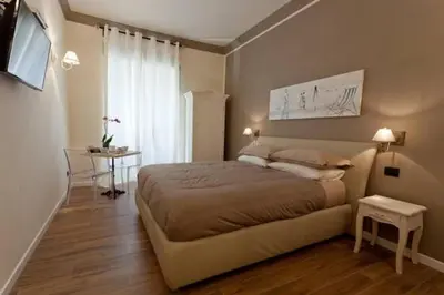 a bedroom with a bed and a table in it at Rome Eternal City in Rome