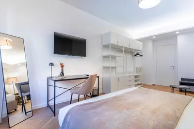 a bedroom with a bed and a desk with a computer at Cyprus - Roma's Delightful Lodges in Rome