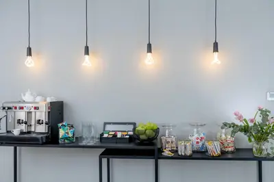a counter with a coffee maker and fruit on it at Corso Vittorio 308 in Rome