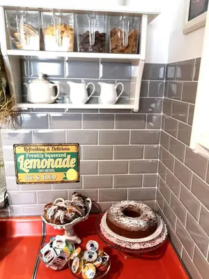 a table with a chocolate cake and a sign on it at La Chiave di Roma in Rome