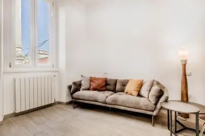a living room with a couch and a table at The Trastevere Apartment in Rome