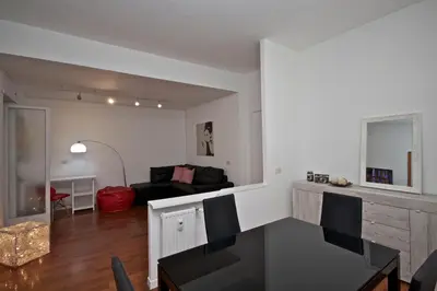 a living room with a table and a couch at PORTA PORTESE apartment in Rome