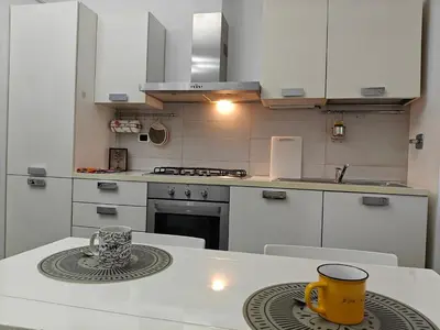 a kitchen with a table with a yellow mug on it at Gregorio VII Dream House in Rome