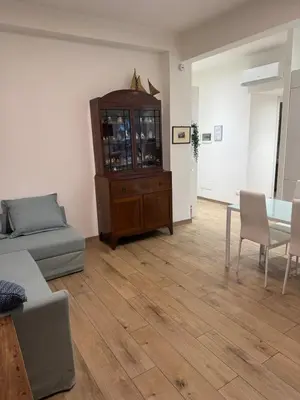 a living room with a couch and a dining table at Annalisa Home in Rome