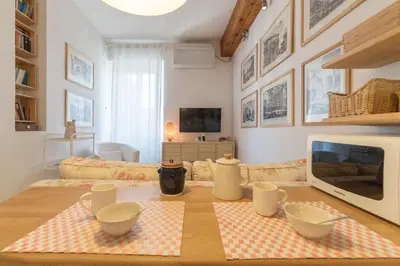 a living room with a table with bowls on it at Romeathome146 - Monti in Rome