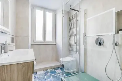 a bathroom with a shower and a toilet and a sink at Biancaapartment in Rome