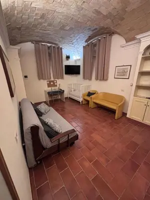 a living room with a bed and a couch at Sophia s Home in Rome