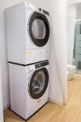 a washing machine and a dryer in a room at RoomApartment Roma in Rome