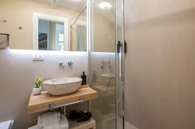 a bathroom with a sink and a shower at Pantheon Suites Rome 1 in Rome