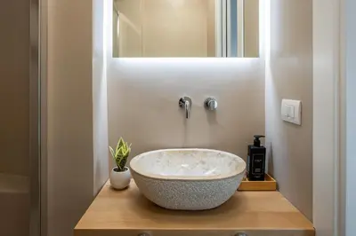 a bathroom with a large bowl sink on a counter at Pantheon Suites Rome 1 in Rome