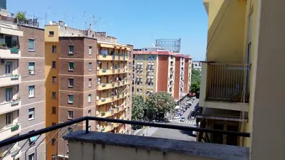 a view of a city from a balcony with buildings at B&B trastevere 2 in Rome