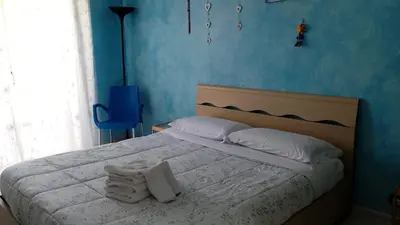 a bedroom with a bed with towels on it at B&B trastevere 2 in Rome