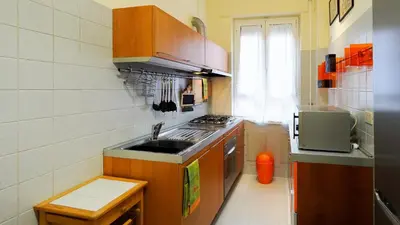 a small kitchen with a sink and a stove at La Casa che Vorrei in Rome