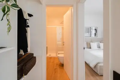 a bathroom with a bed and a toilet in a room at San Lorenzo Labicana Luxury Apartment in Rome