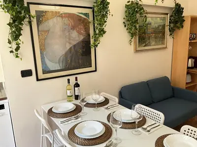 a dining room with a white table and chairs at Maria House Saint Peter in Rome