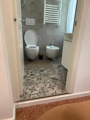 a bathroom with a toilet and a bidet at Casa Romana Vaticano-Metro in Rome