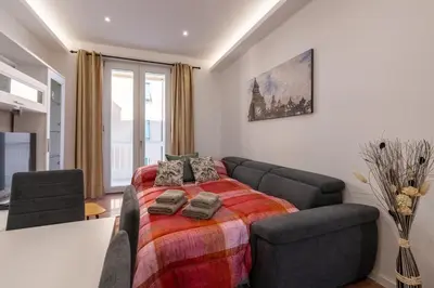 a bedroom with a bed and a couch at Casa Romana Vaticano-Metro in Rome