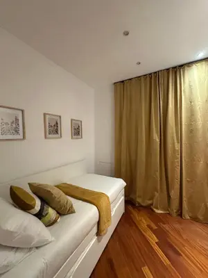 a bedroom with two beds and a window at Balduina 225 in Rome
