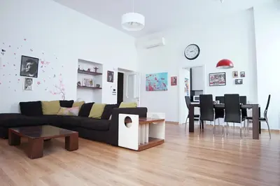 a living room with a couch and a table at FLOUR SUITE - Rome Apartment in Rome