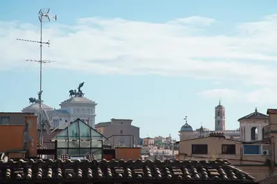 a view of the roofs of buildings in a city at FLOUR SUITE - Rome Apartment in Rome