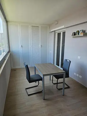 a dining room with a table and two chairs at Two bedrooms with terrace in Rome
