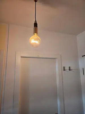 a light hanging over a door in a room at Two bedrooms with terrace in Rome
