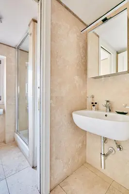 a bathroom with a sink and a shower at Montevecchio Boutique Apartments in Rome