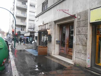 a building on a city street in the rain at Via Cipro in Rome