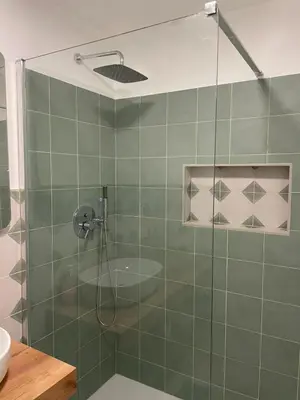 a shower with a glass door in a bathroom at Bed & Breakfast RCH Roman Central House in Rome