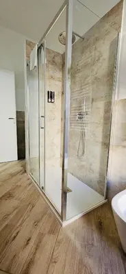 a bathroom with a shower and a toilet and a sink at La casa di Tilde Roma Angelino in Rome