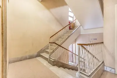 an empty staircase in a building with a window at Villa Up in Rome