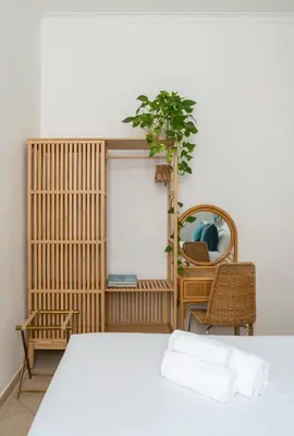 a bedroom with a bed and a chair and a mirror at Terrazza San Lorenzo - Luxury Apartment - Roma Centro in Rome