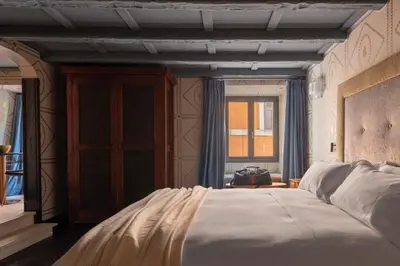 a bedroom with a large bed and a window at Apppartamenti Vicolo degli Osti in Rome
