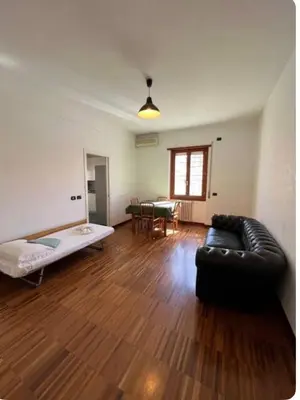 a living room with a couch and a table at Maison del Forte Boccea 108 in Rome