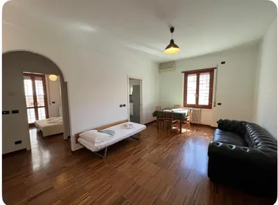 a living room with a couch and a table at Maison del Forte Boccea 108 in Rome
