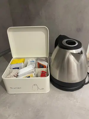 a lunch box with a tea kettle on a counter at Trevi 88 in Rome