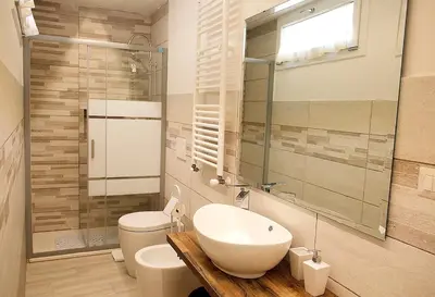 a bathroom with a white sink and a toilet at Trevi 88 in Rome