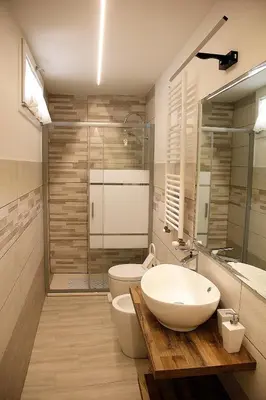 a bathroom with a sink and a toilet and a shower at Trevi 88 in Rome
