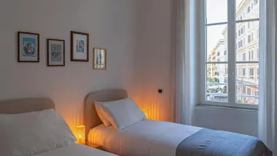 a bedroom with a bed and a window and lights at Marble House 7 in Rome