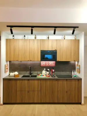 a kitchen with a sink and a microwave at Casa di Corto in Rome