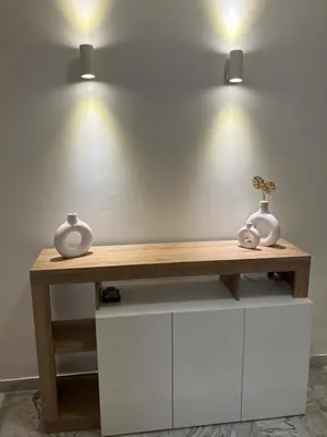 a wooden table with two vases on top of it at FAIROME Apartment Albricci in Rome