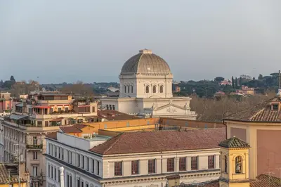 a balcony of a house with a view of a city at Arenula16 - Attico con terrazza panoramica in Rome