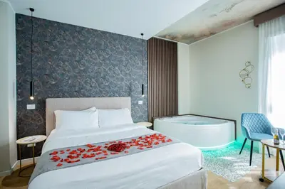 a bedroom with a bed and a bath tub at Rome suite Rome Vaticano Guest house in Rome