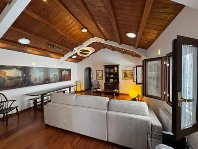 a couch in a living room with blue lights at Domus Colosseum, detached house just few steps from the Colosseum in Rome