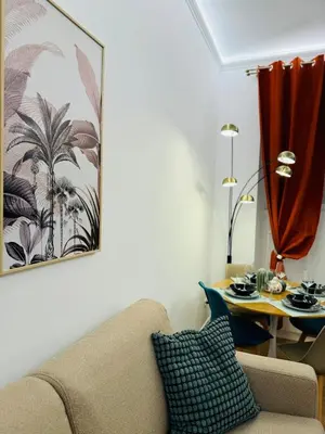 a living room with a couch and a table at Friendly Apartment San Saba in Rome