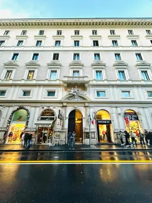 a large white building on a city street at TritHome in Rome